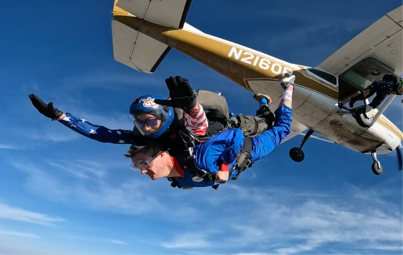 President John Marshall skydiving to gain a new perspective of our "Human Scale" university.